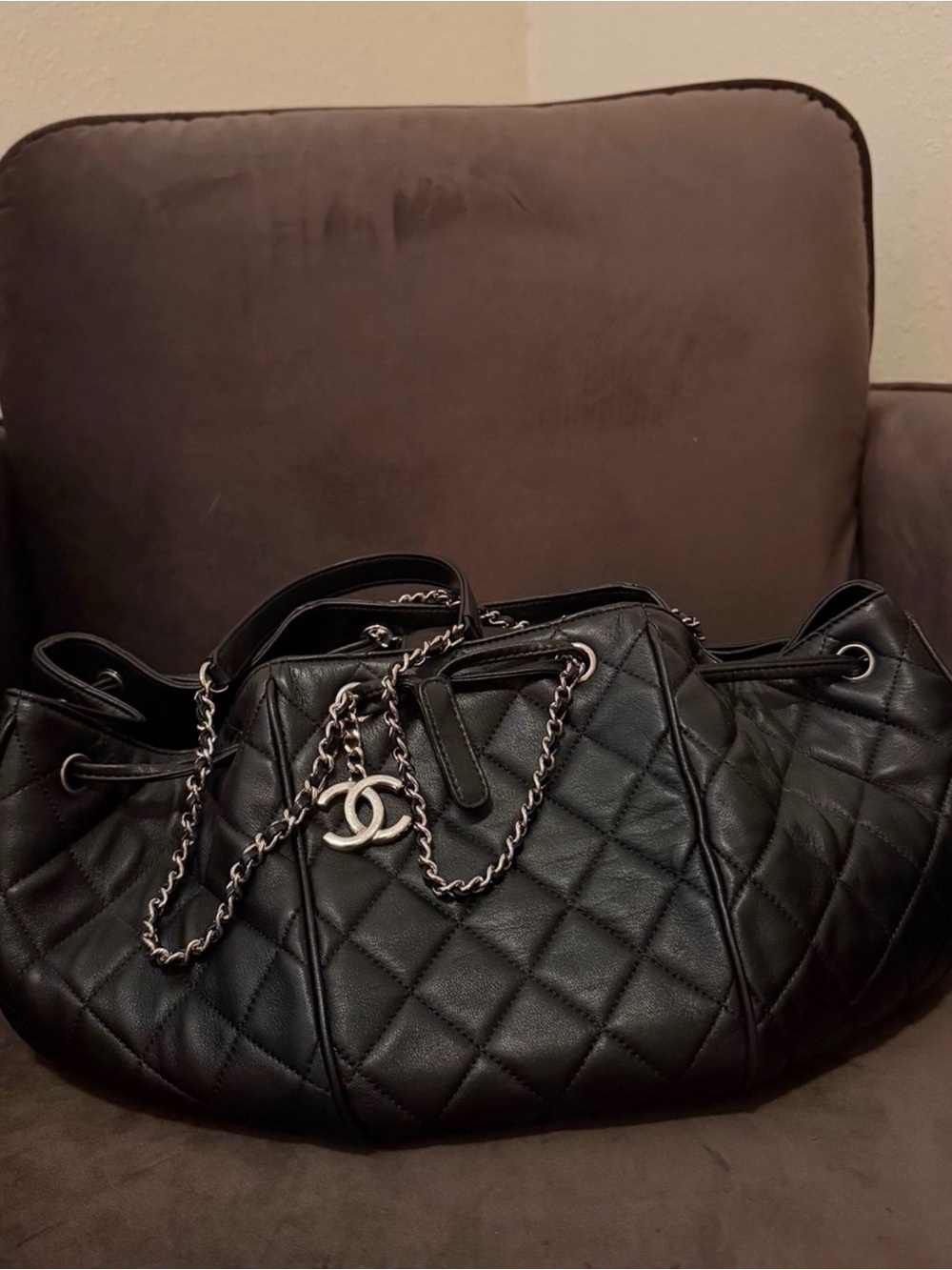 CHANEL Black Quilted Leather Drawstring Shoulder Bag with CC Charm